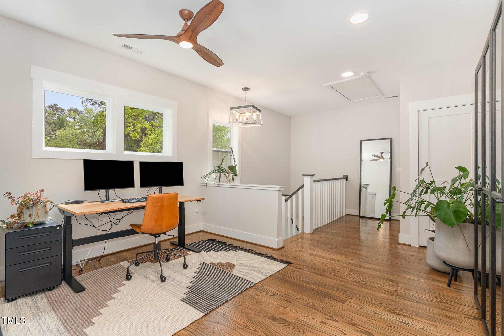 1422 Banbury Road Raleigh, NC 27607 - Photo 17 of 48 a workspace with furniture window and wooden floor