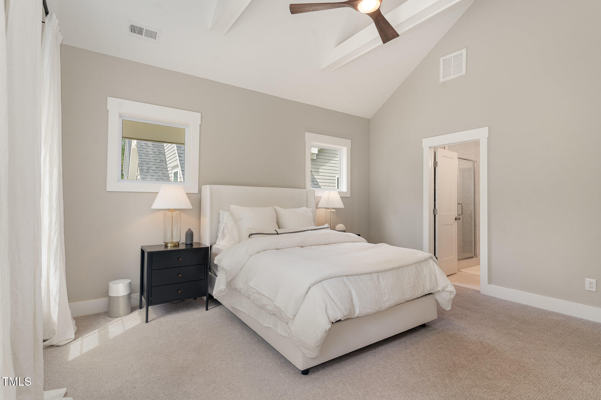 1422 Banbury Road Raleigh, NC 27607 - Photo 19 of 48 a bedroom with a bed and a lamp on dresser