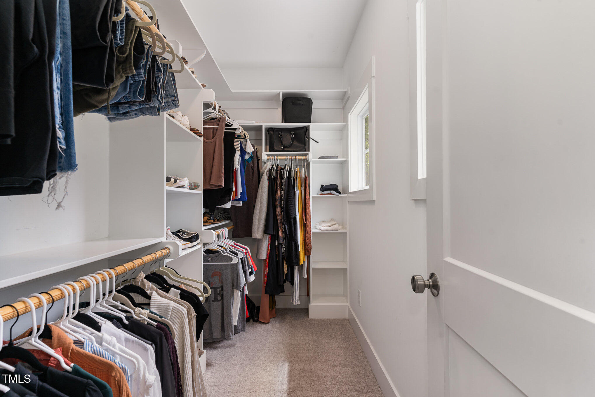 1422 Banbury Road Raleigh, NC 27607 - Photo 21 of 48 a view of walk in closet with clothes