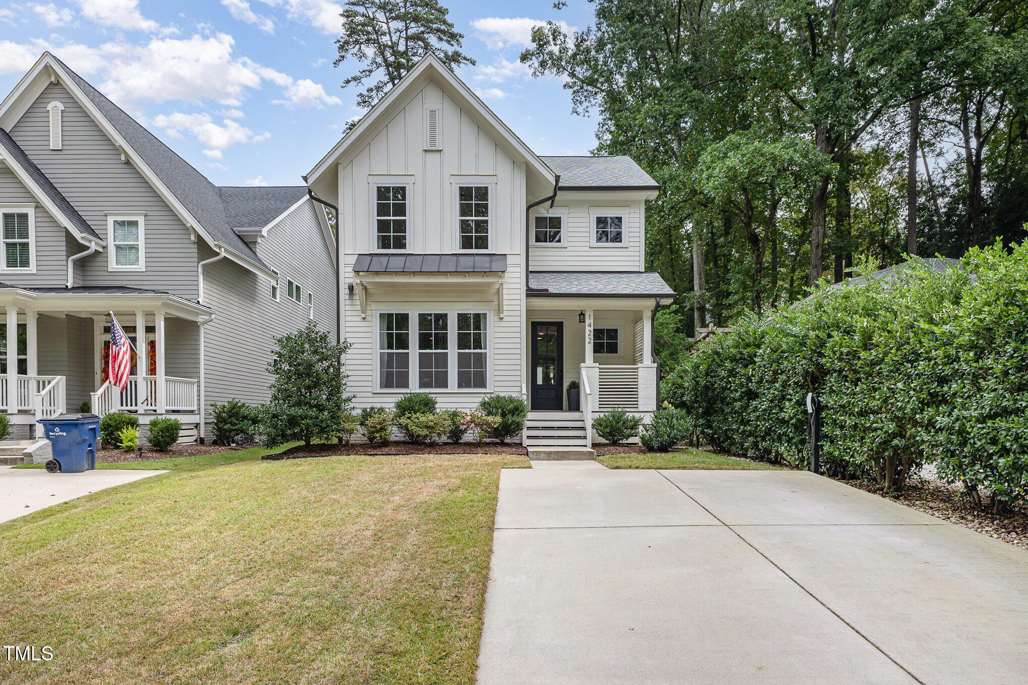 1422 Banbury Road Raleigh, NC 27607 - Photo 40 of 48 a front view of a house with a yard and potted plants