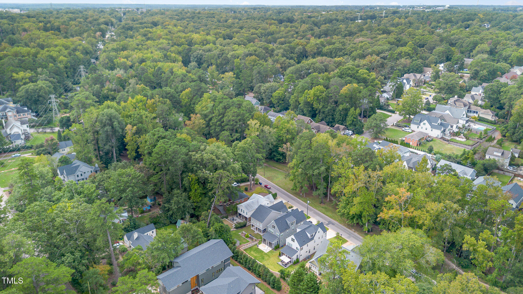 1422 Banbury Road Raleigh, NC 27607 - Photo 45 of 48 an aerial view of residential houses with outdoor space and trees