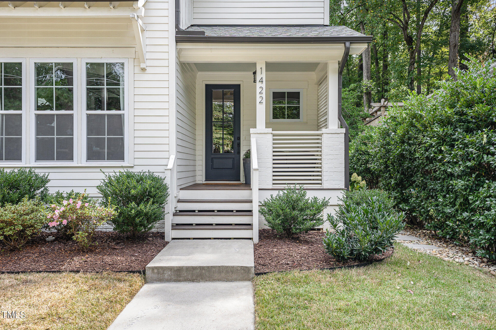 1422 Banbury Road Raleigh, NC 27607 - Photo 3 of 48 a view of a house with potted plants