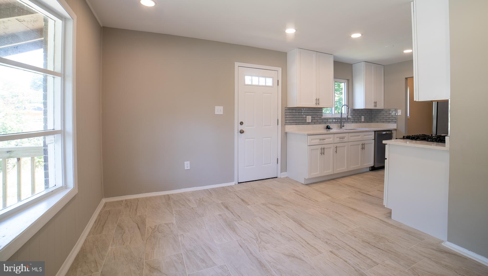 5303 Whitfield Chapel Road Lanham, MD 20706 - Photo 3 of 35 Bright Eat-In Kitchen w/ Outside Door Entrance