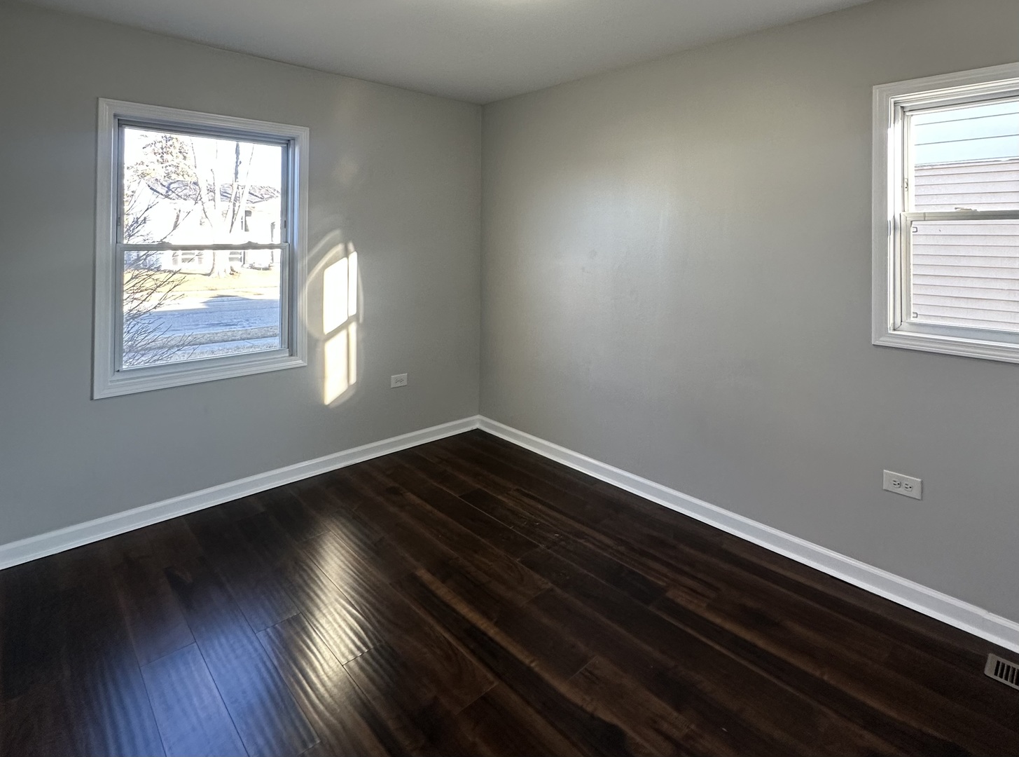 344 Hickory Avenue Romeoville, IL 60446 - Photo 11 of 14 an empty room with wooden floor and windows