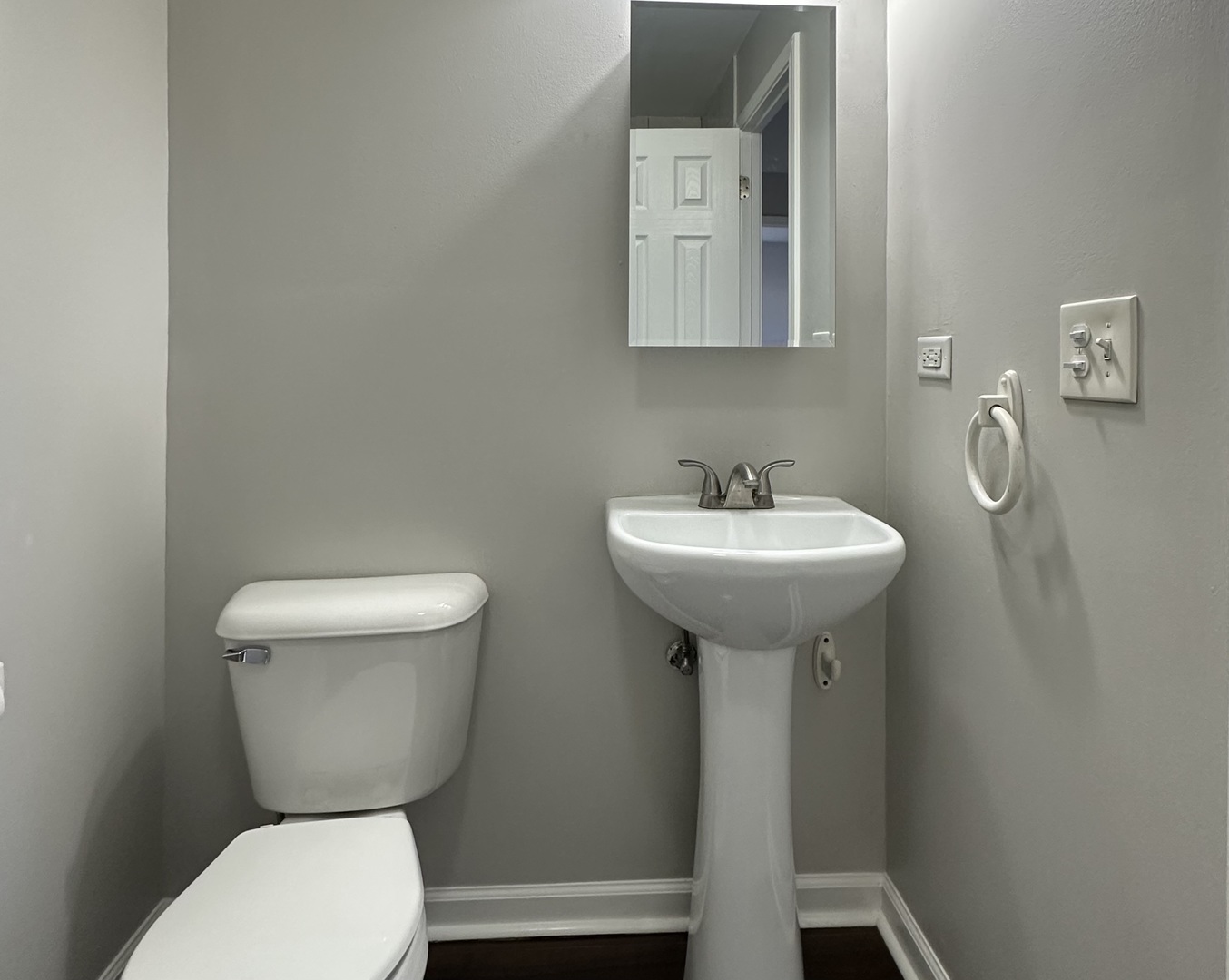 344 Hickory Avenue Romeoville, IL 60446 - Photo 12 of 14 a bathroom with a toilet sink and mirror