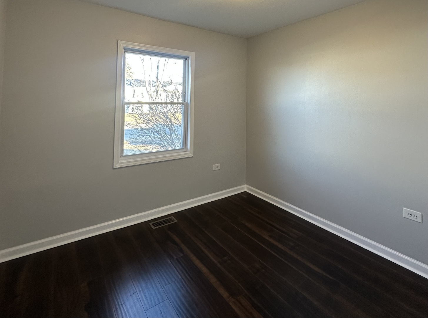 344 Hickory Avenue Romeoville, IL 60446 - Photo 13 of 14 an empty room with wooden floor and windows