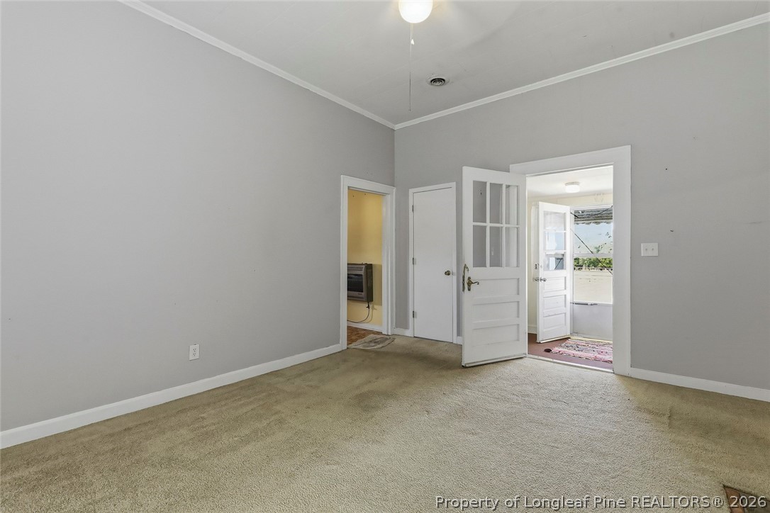 249 Nicholson Road Rockingham, NC 28379 - Photo 20 of 47 an empty room with an entryway and windows