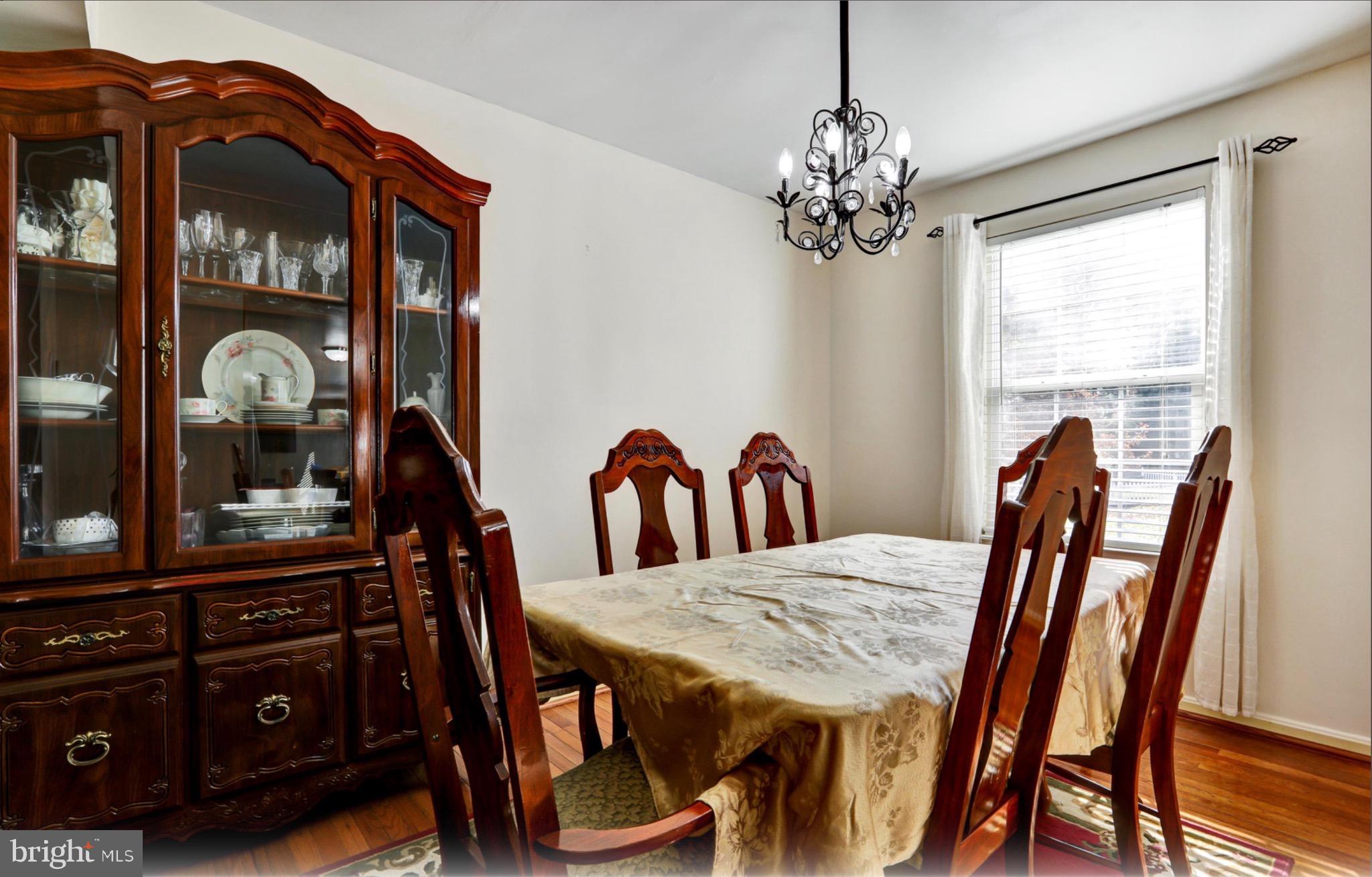 4305 Silver Spring Road Perry Hall, MD 21236 - Photo 11 of 29 a view of a dining room with furniture and chandelier