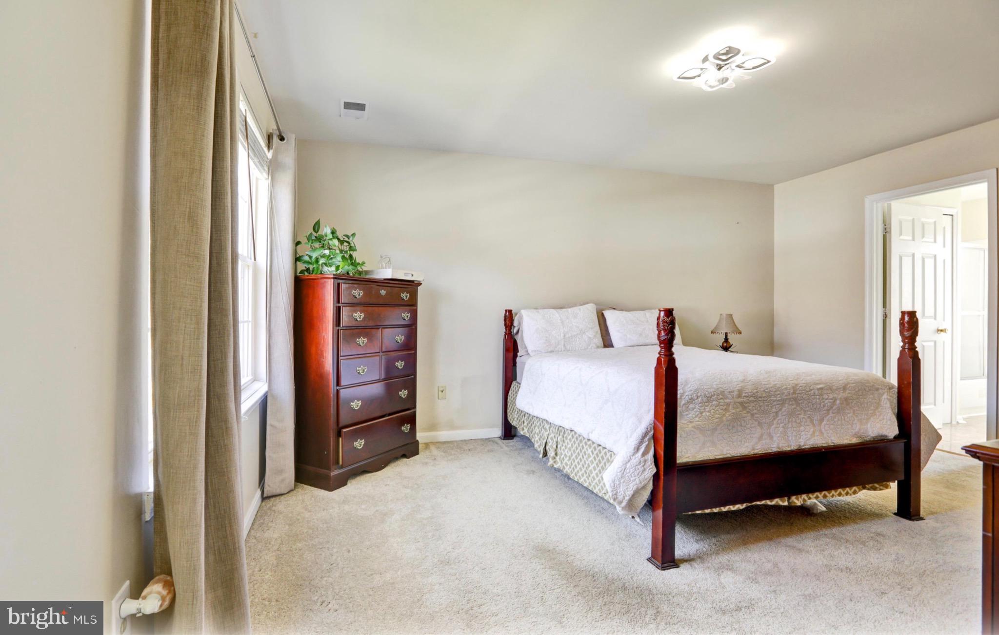 4305 Silver Spring Road Perry Hall, MD 21236 - Photo 12 of 29 a bedroom with a bed and a tv