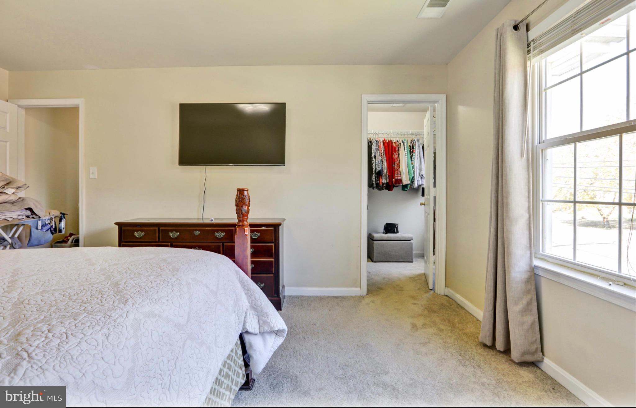 4305 Silver Spring Road Perry Hall, MD 21236 - Photo 14 of 29 a bedroom with a bed and a flat screen tv