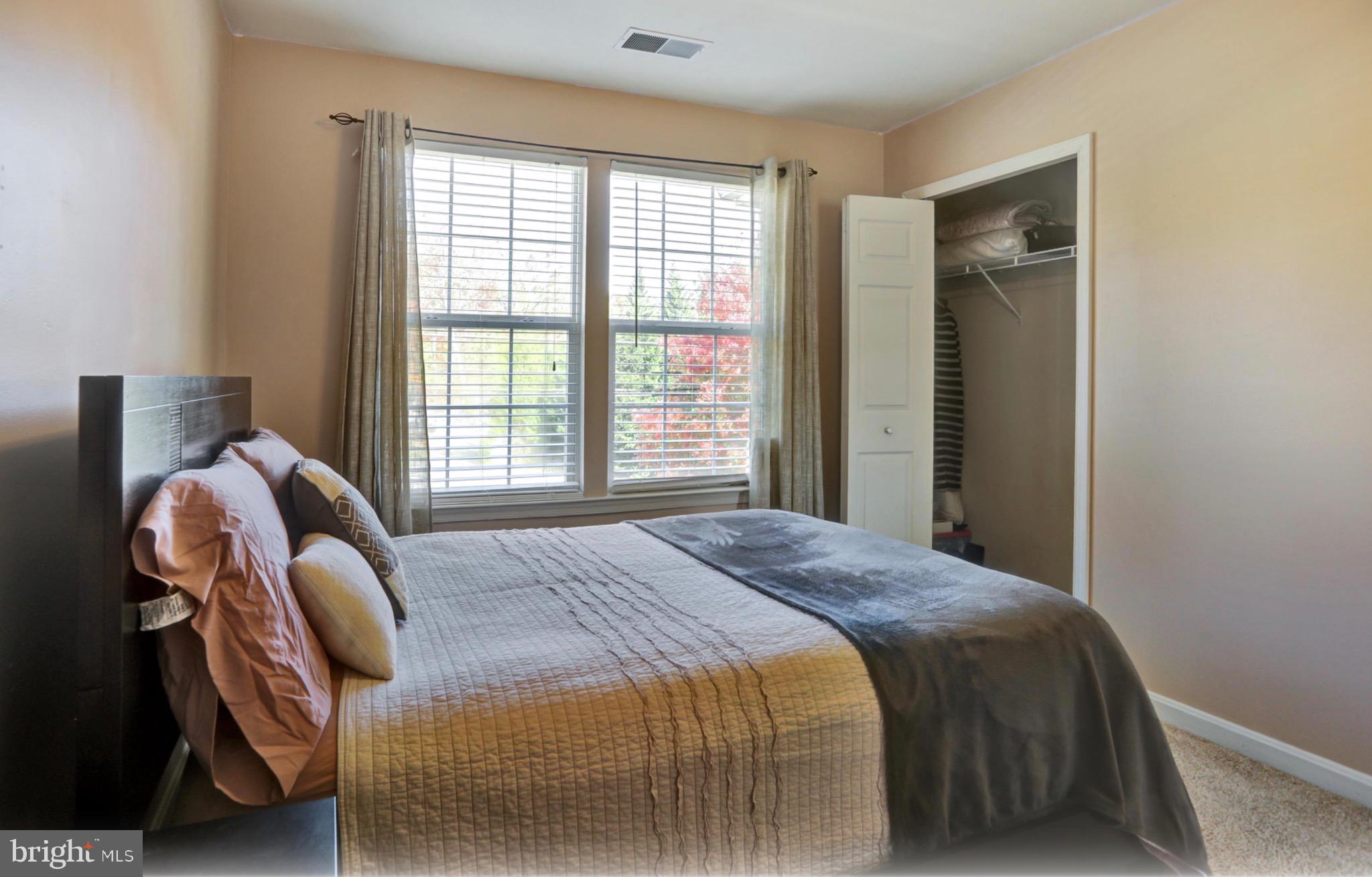 4305 Silver Spring Road Perry Hall, MD 21236 - Photo 15 of 29 a bedroom with a bed and windows