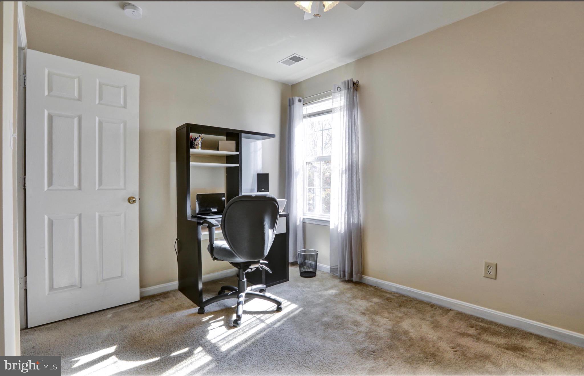 4305 Silver Spring Road Perry Hall, MD 21236 - Photo 19 of 29 a view of a workspace with furniture and a window