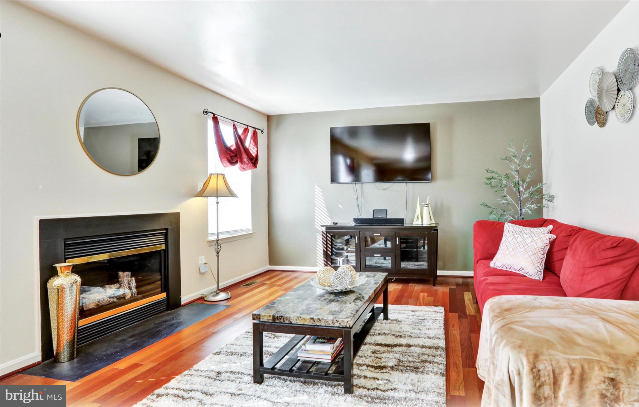 4305 Silver Spring Road Perry Hall, MD 21236 - Photo 4 of 29 a living room with furniture and a fireplace
