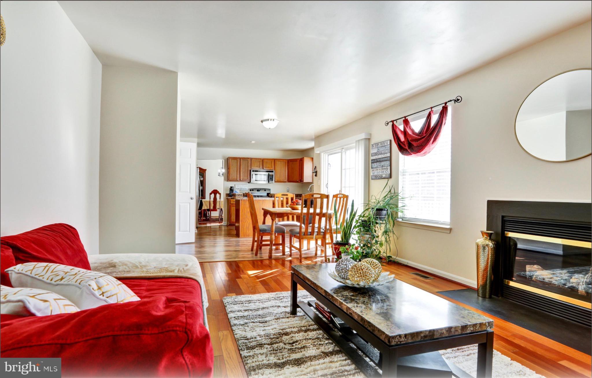 4305 Silver Spring Road Perry Hall, MD 21236 - Photo 6 of 29 a living room with furniture and a fireplace