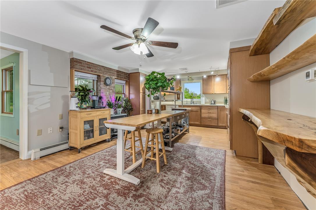 4831 Steuben Road Nazareth, PA 18064 - Photo 5 of 34 A well-lit kitchen area features a large island, wood flooring, and natural wood accents.