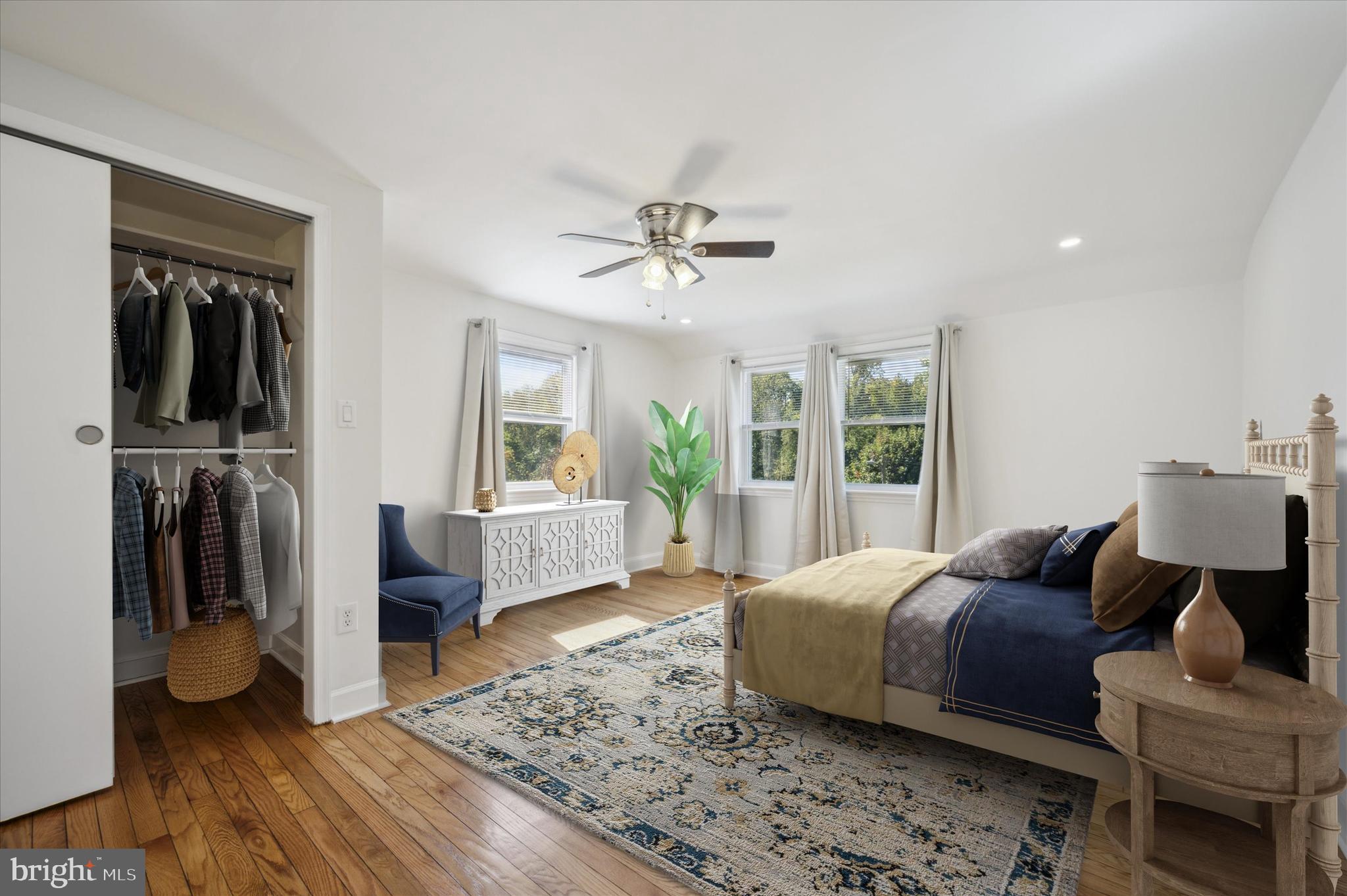 907 Powder Mill Lane Wynnewood, PA 19096 - Photo 12 of 31 a spacious bedroom with a bed and glass door
