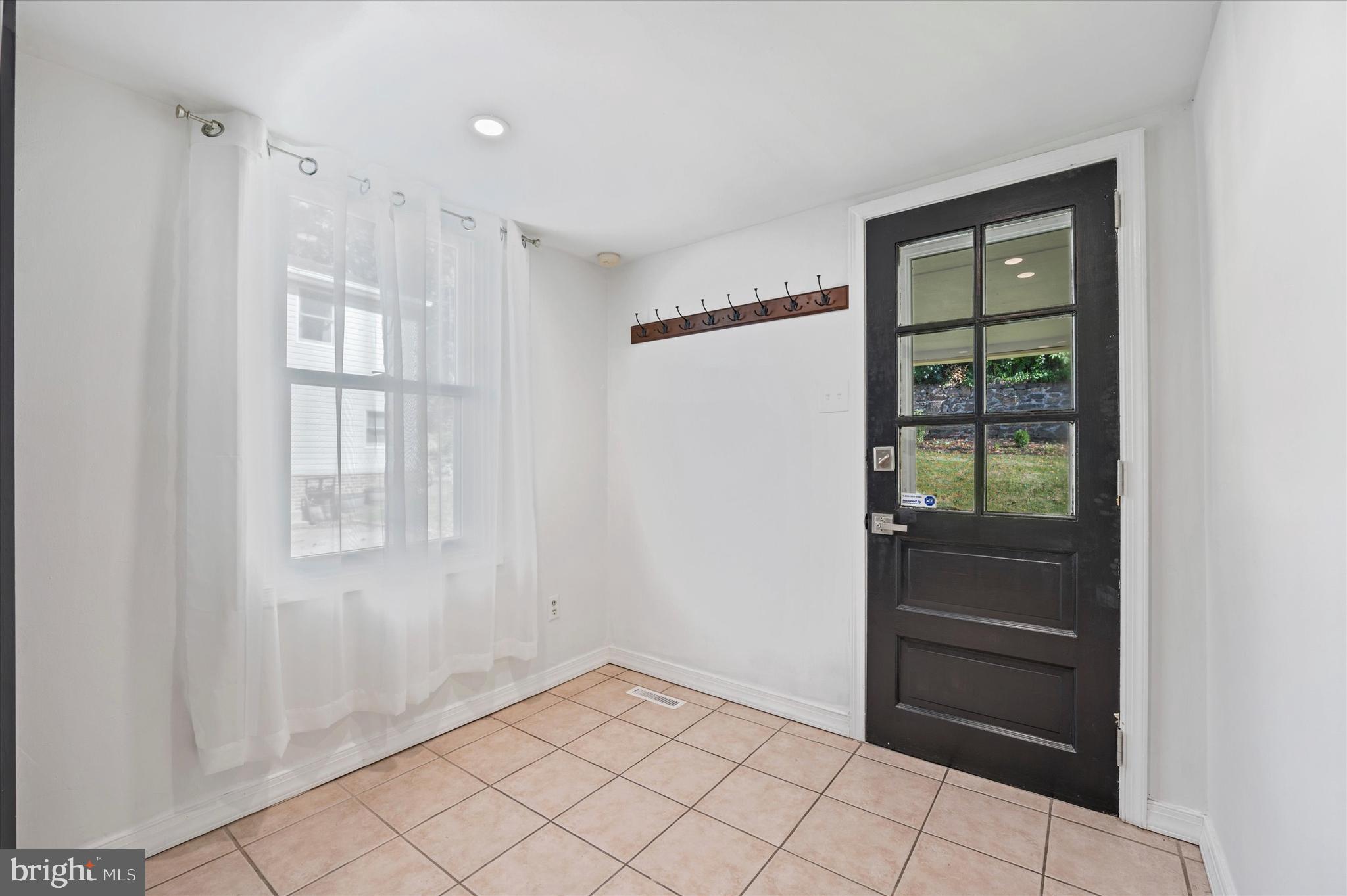 907 Powder Mill Lane Wynnewood, PA 19096 - Photo 14 of 31 a view of an empty room with a window