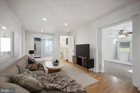 an empty room with closet and windows