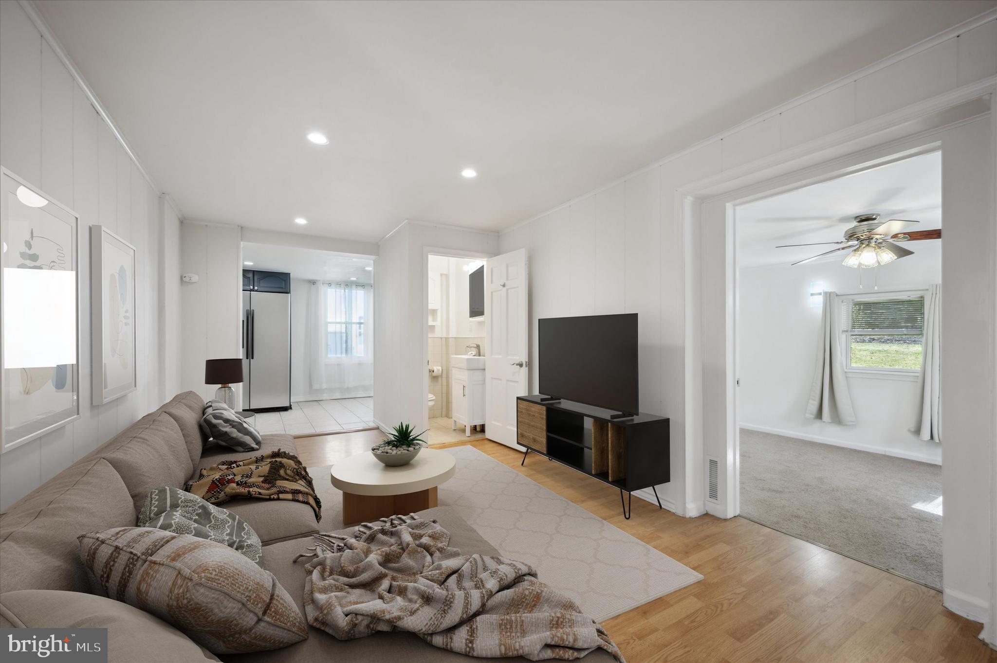 907 Powder Mill Lane Wynnewood, PA 19096 - Photo 16 of 31 a living room with furniture and a flat screen tv