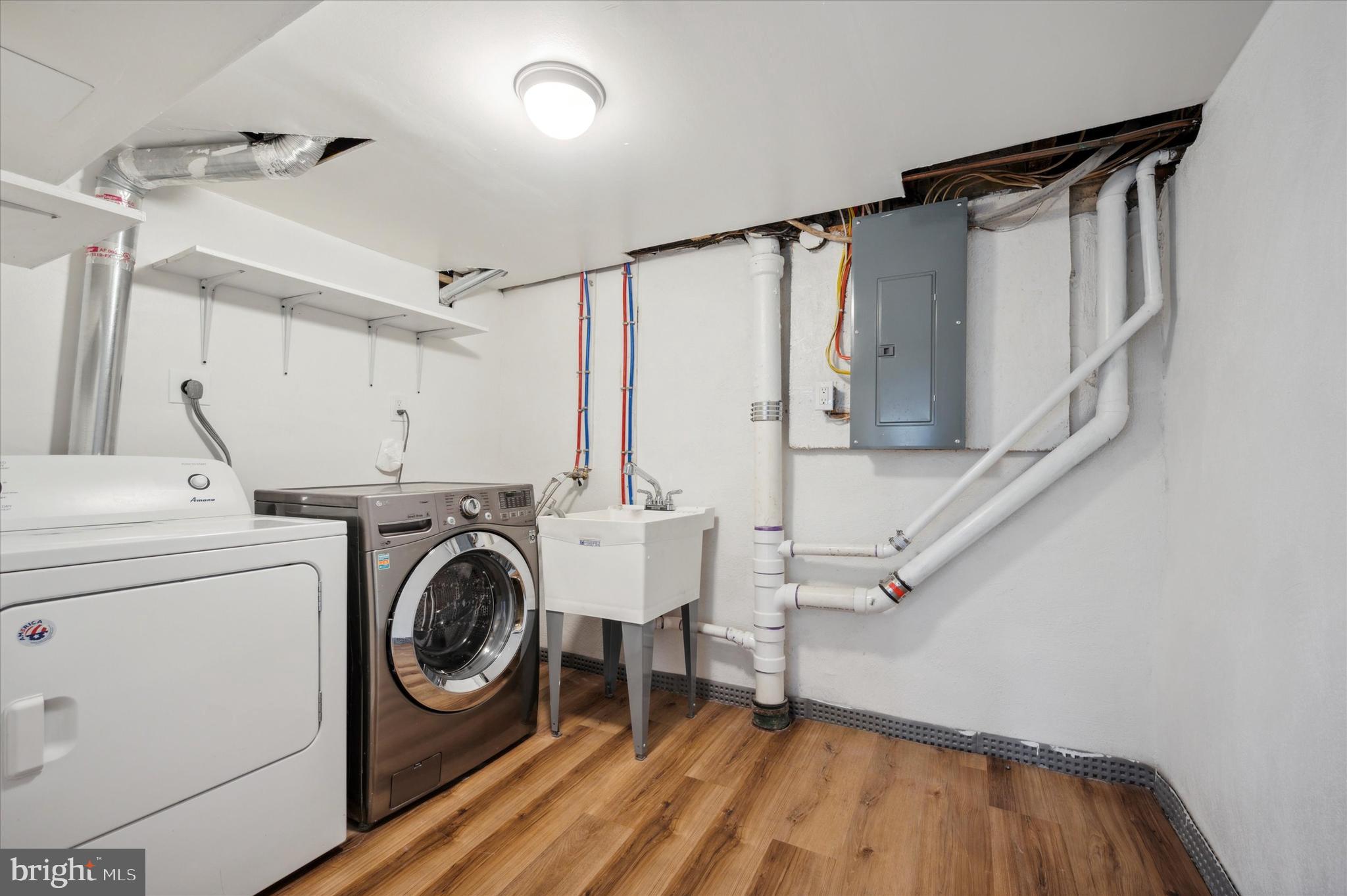 907 Powder Mill Lane Wynnewood, PA 19096 - Photo 29 of 31 a view of storage and utility room with washer and dryer