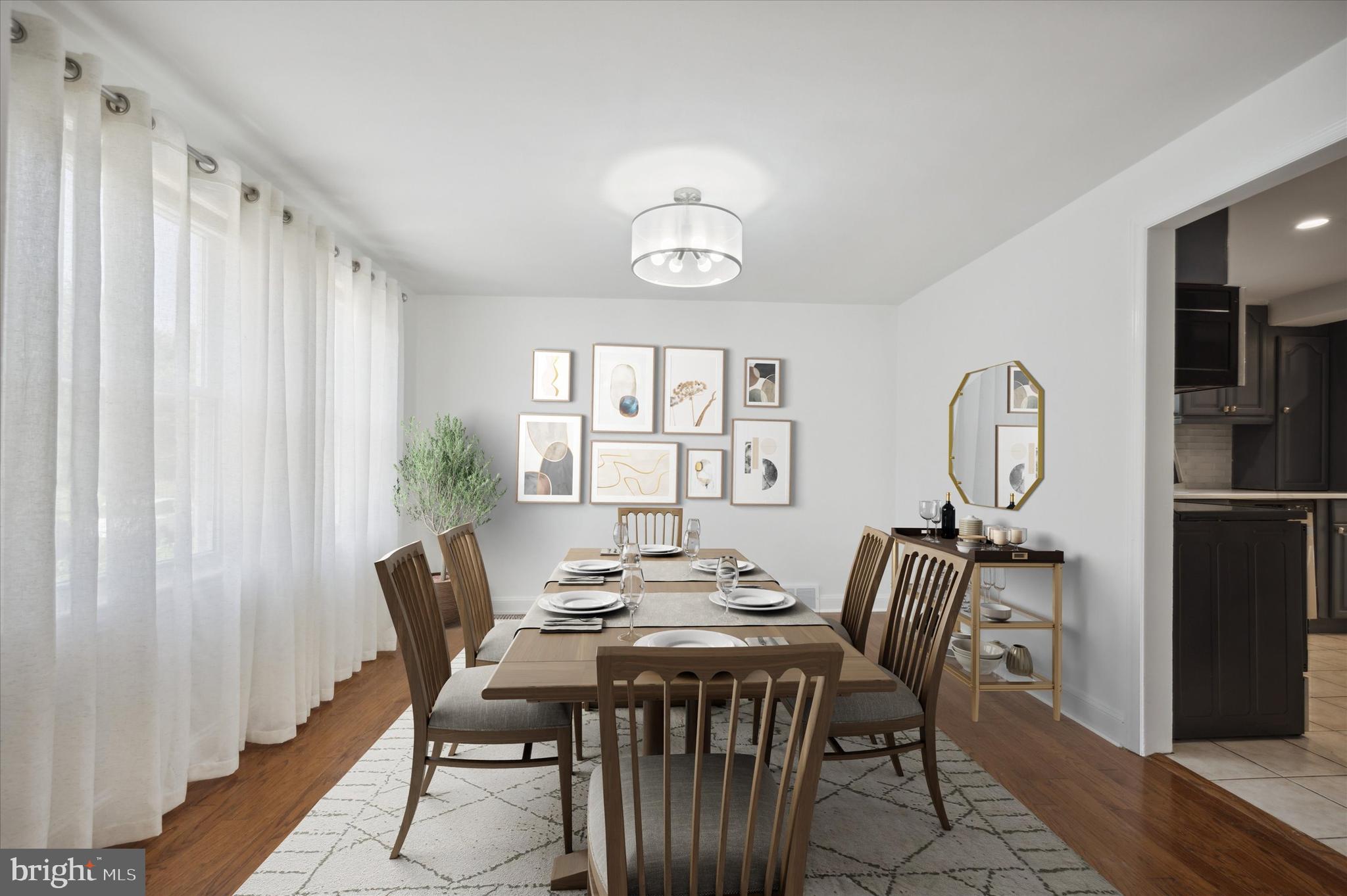 907 Powder Mill Lane Wynnewood, PA 19096 - Photo 7 of 31 a view of a dining room with furniture window and wooden floor