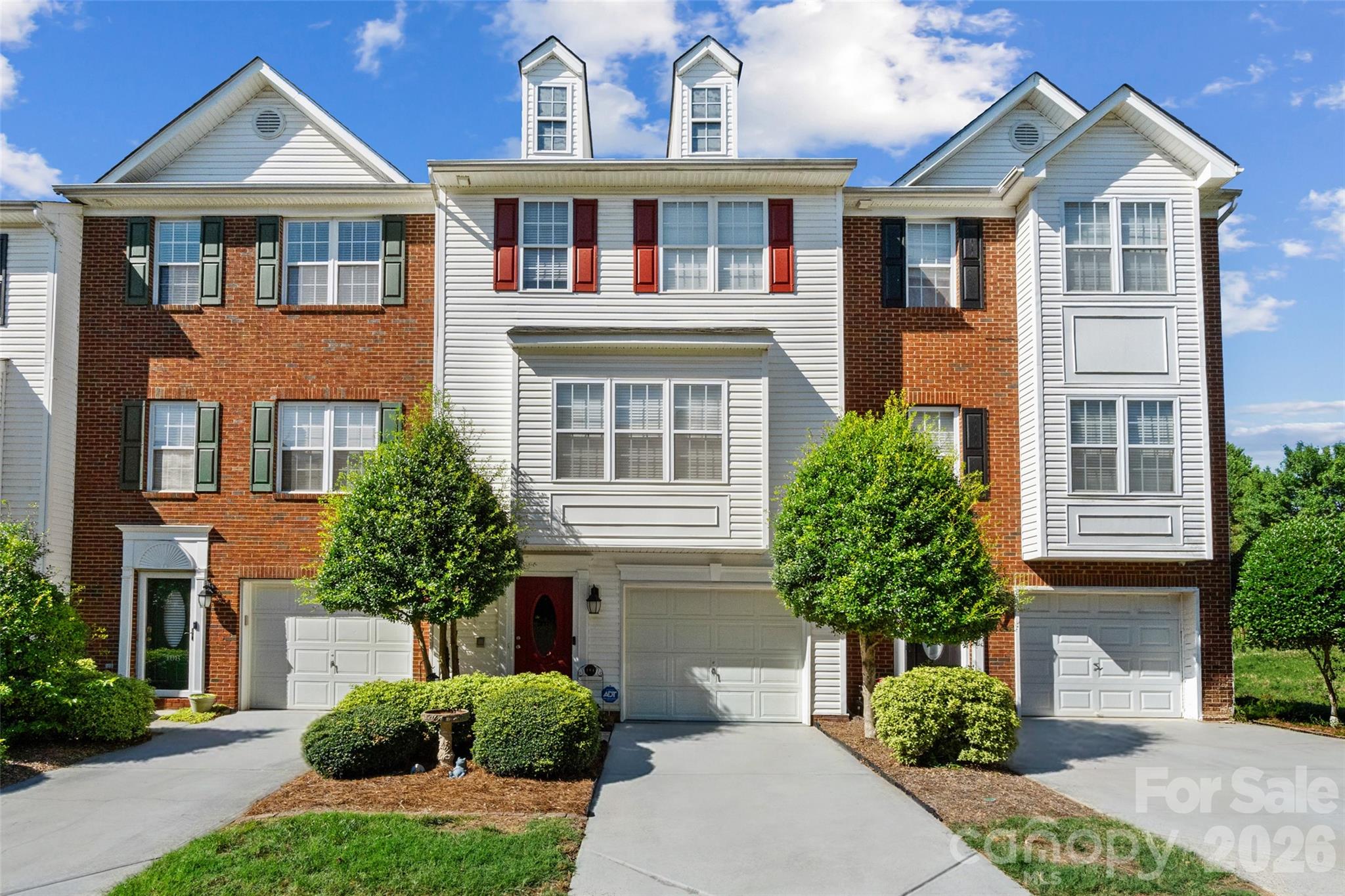 104 Rock Ridge Lane Mount Holly, NC 28120 - Photo 1 of 48 a front view of a house with a yard