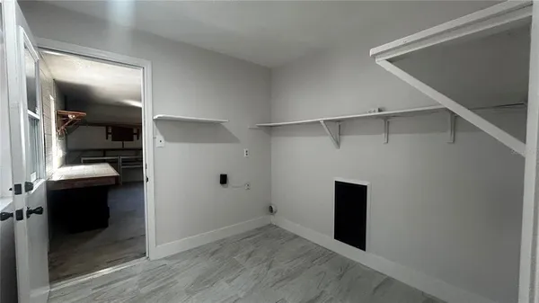 a room with closet and furniture