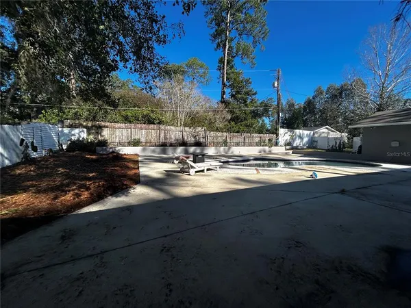 a view of swimming pool and patio