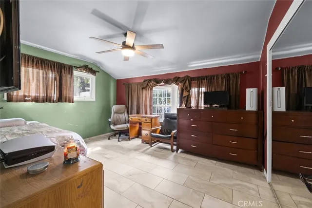 a bed room with a bed and a window