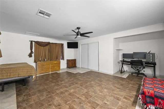 a bedroom with furniture and a bed