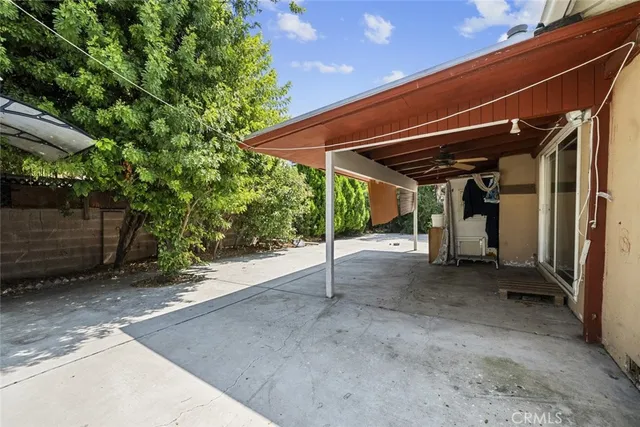 a view of a room with wooden walls