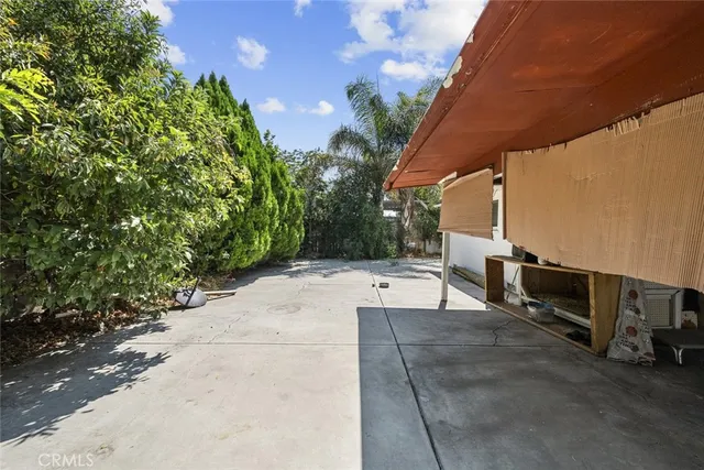 a view of a backyard with sitting area
