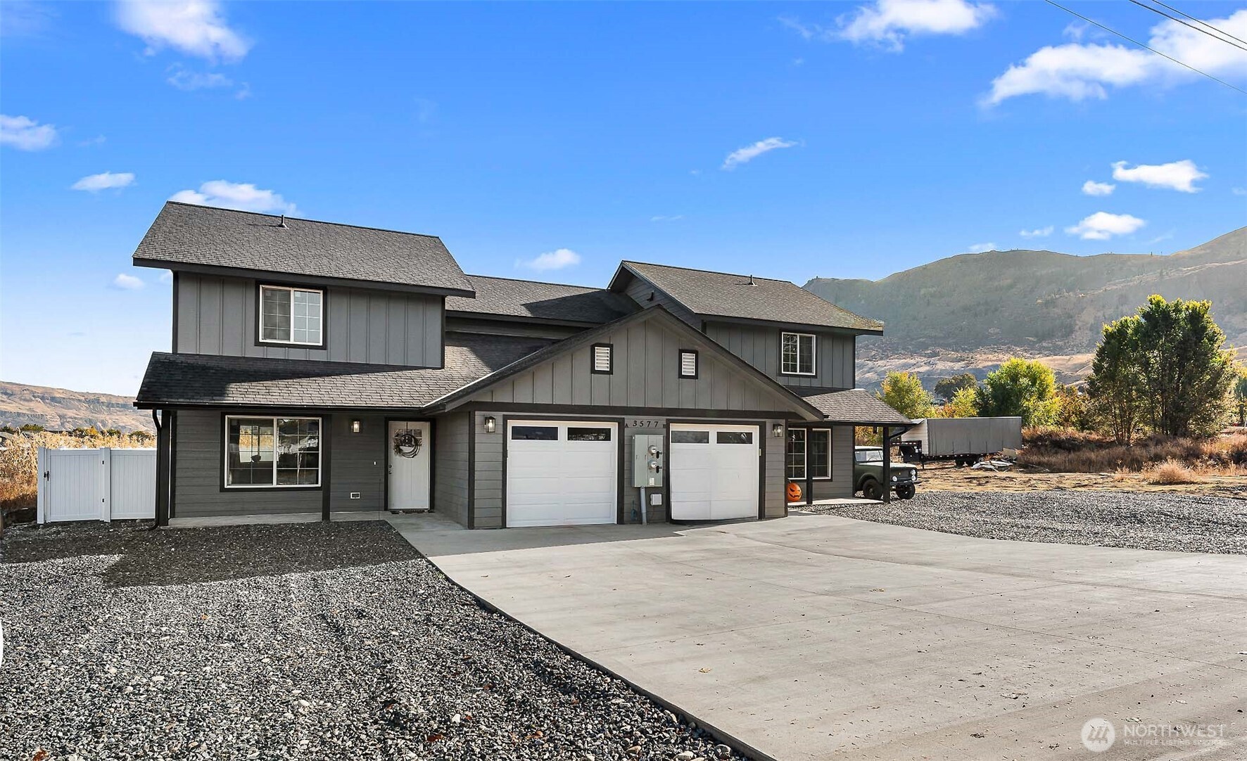 3577 Bainard Road Malaga, WA 98828 - Photo 20 of 39 a front view of a house with a garden
