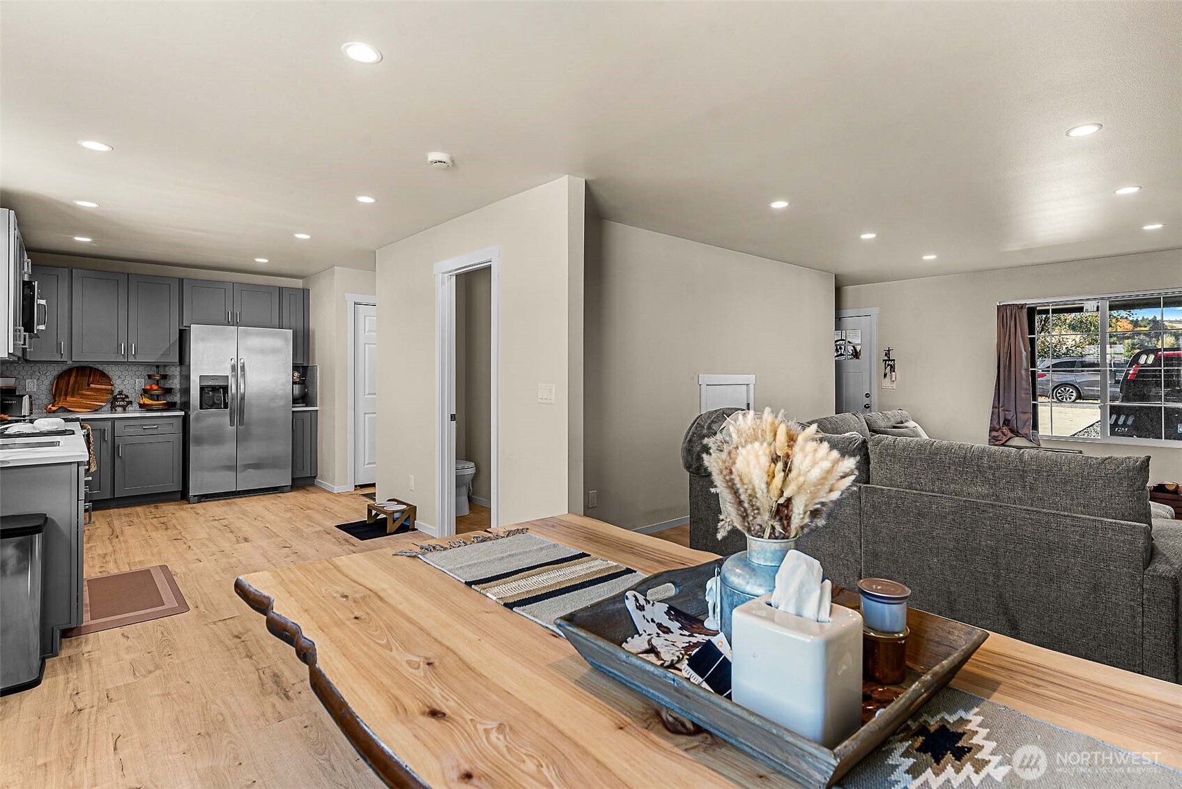 3577 Bainard Road Malaga, WA 98828 - Photo 23 of 39 a kitchen with stainless steel appliances granite countertop a sink refrigerator and cabinets
