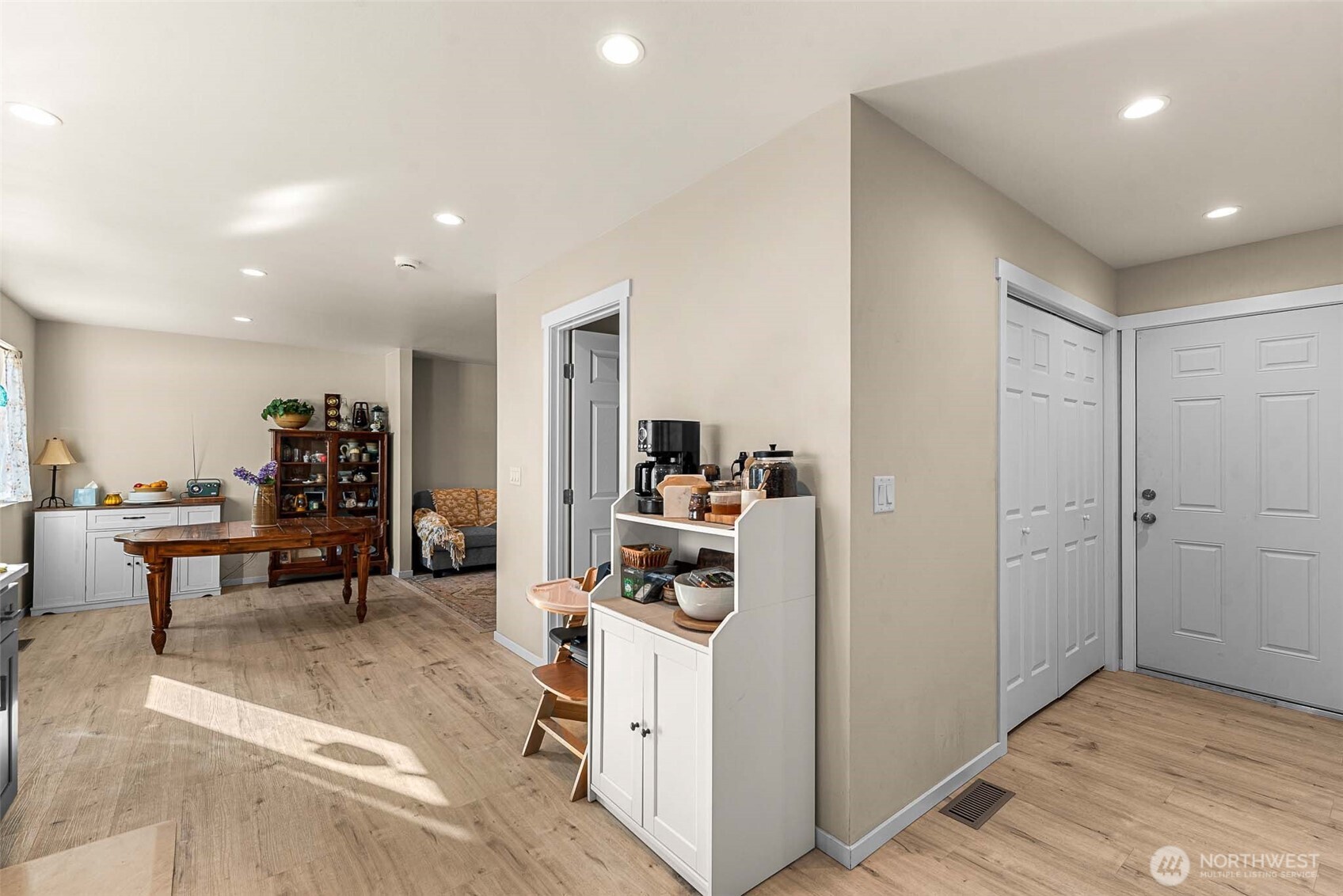 3577 Bainard Road Malaga, WA 98828 - Photo 28 of 39 a living room with furniture and a dining table with wooden floor
