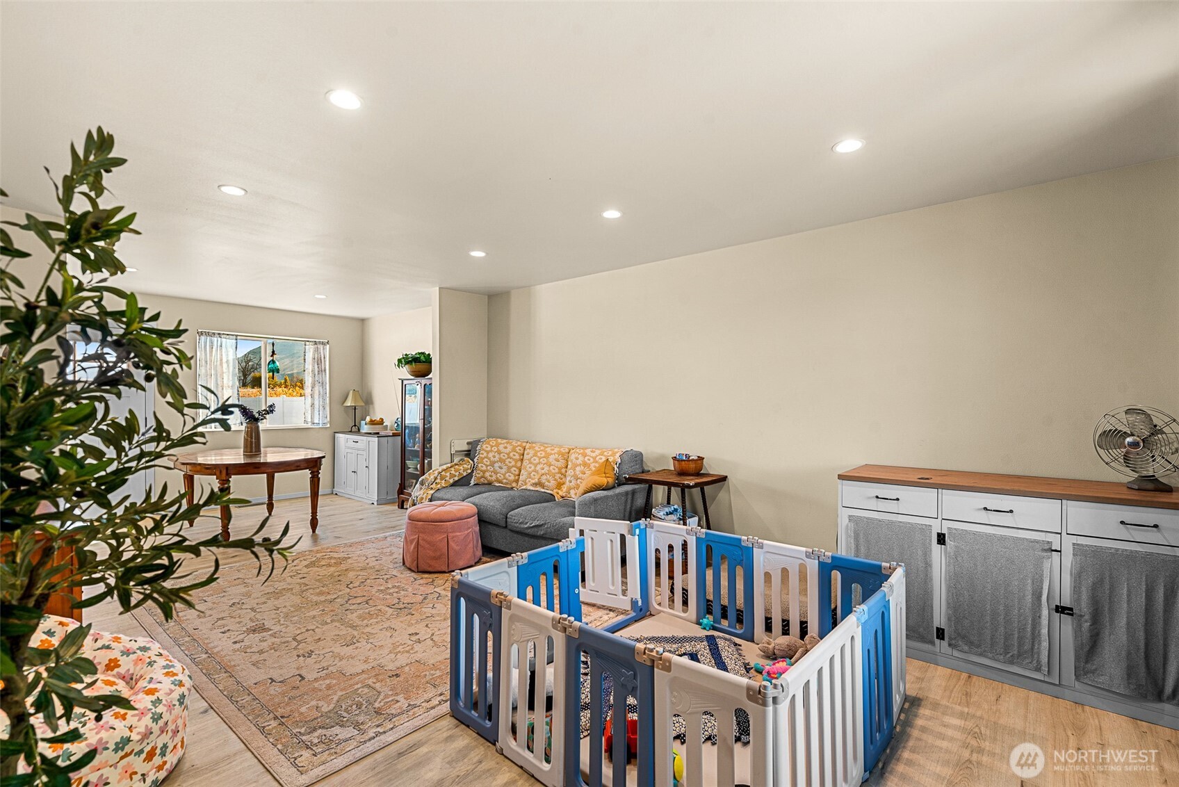 3577 Bainard Road Malaga, WA 98828 - Photo 4 of 39 a living room with furniture and a baby crib