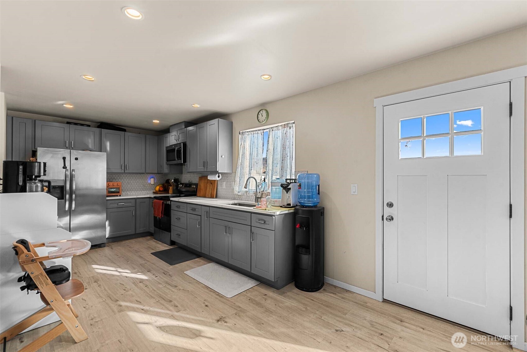3577 Bainard Road Malaga, WA 98828 - Photo 6 of 39 a kitchen with stainless steel appliances kitchen island granite countertop a refrigerator and cabinets