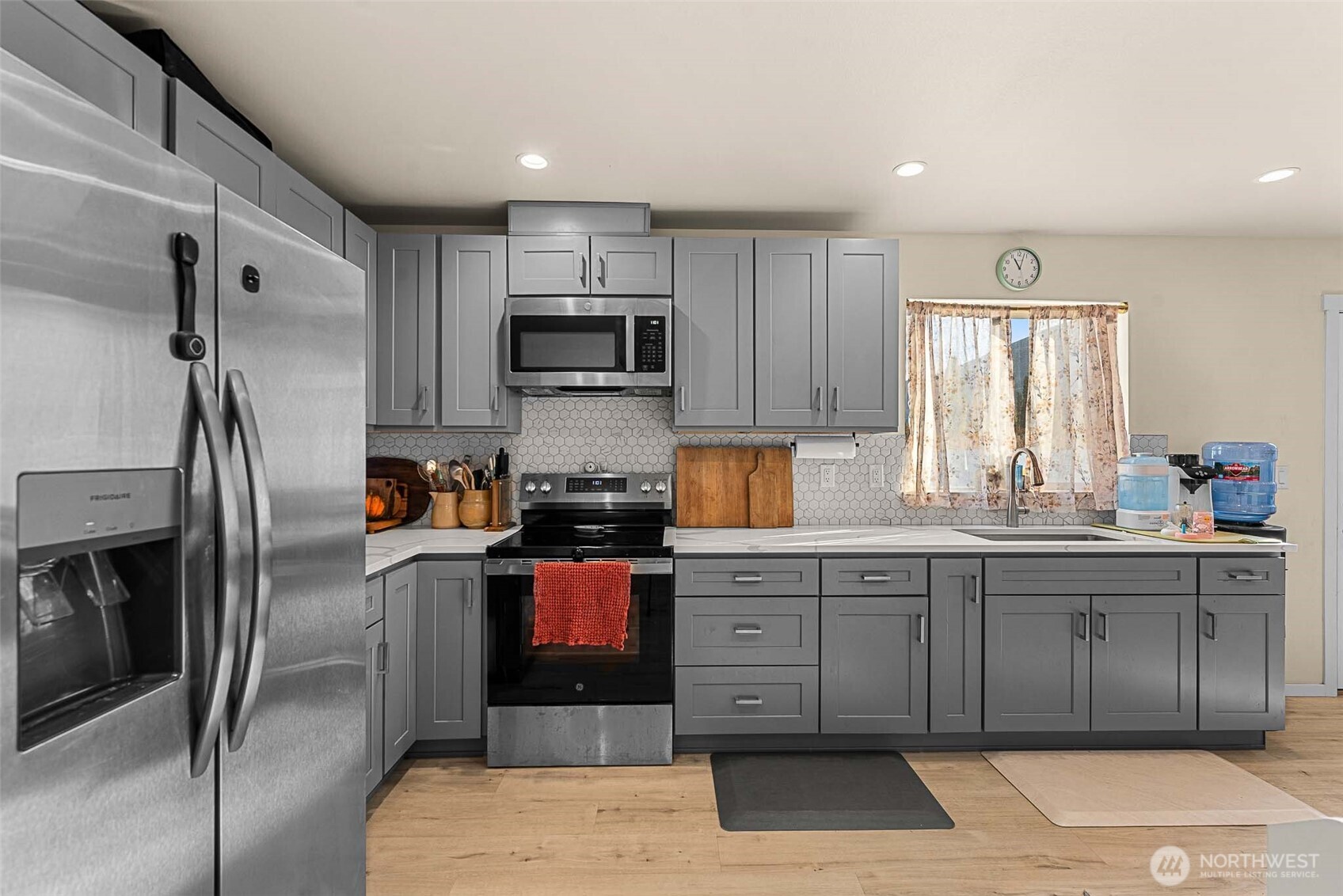 3577 Bainard Road Malaga, WA 98828 - Photo 7 of 39 a kitchen with stainless steel appliances granite countertop a refrigerator and a sink