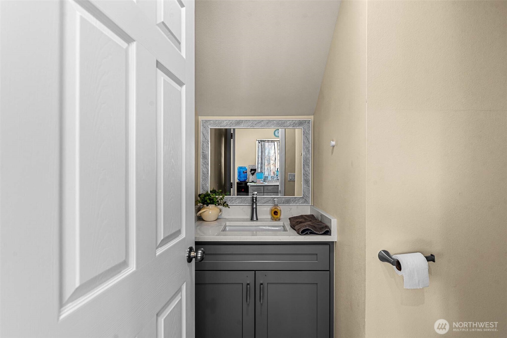 3577 Bainard Road Malaga, WA 98828 - Photo 9 of 39 a hallway with sink and mirror