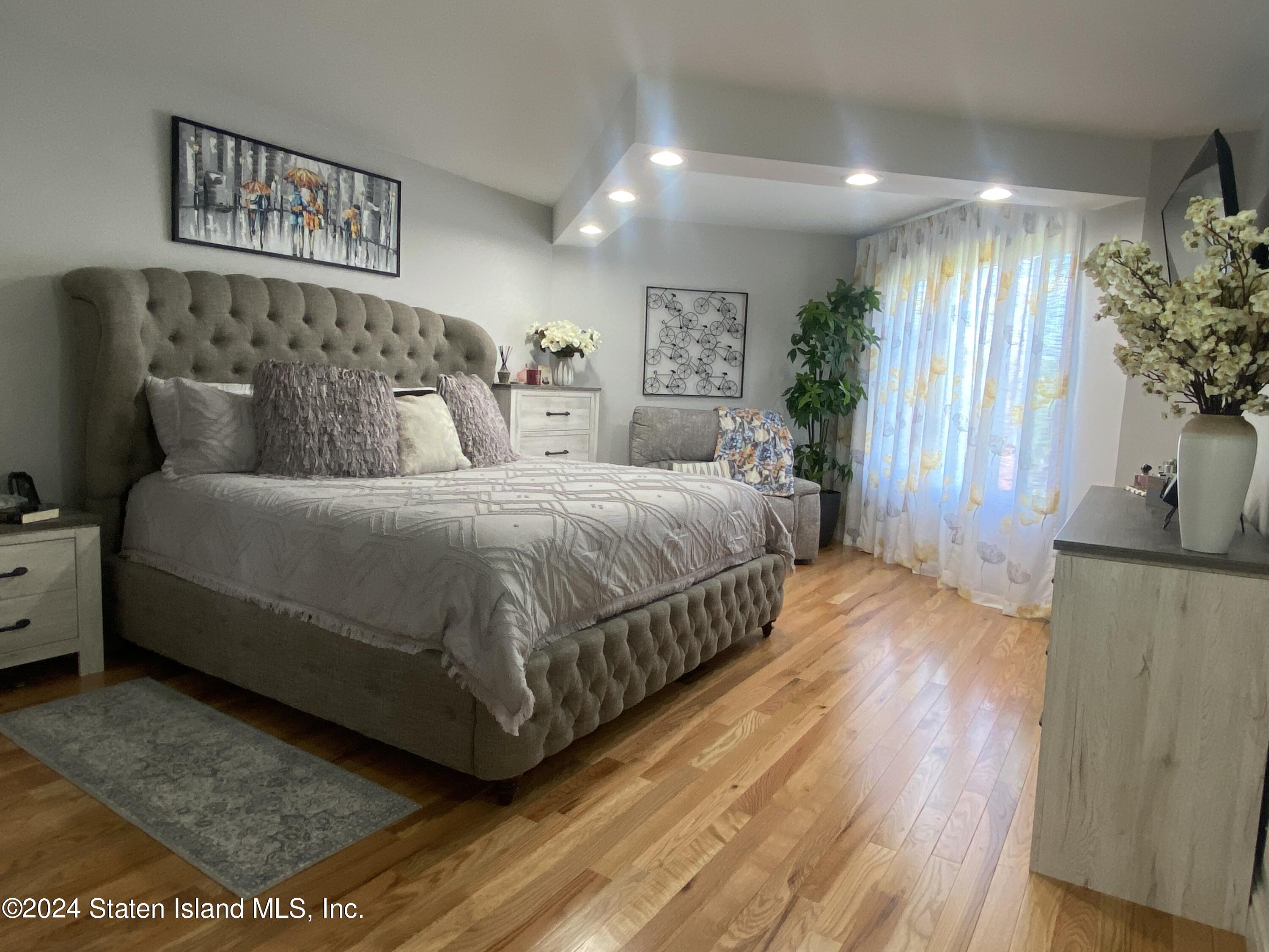 1440 Forest Hill Road, Unit 2 Staten Island, NY 10314 - Photo 15 of 32 a bedroom with a bed and a window