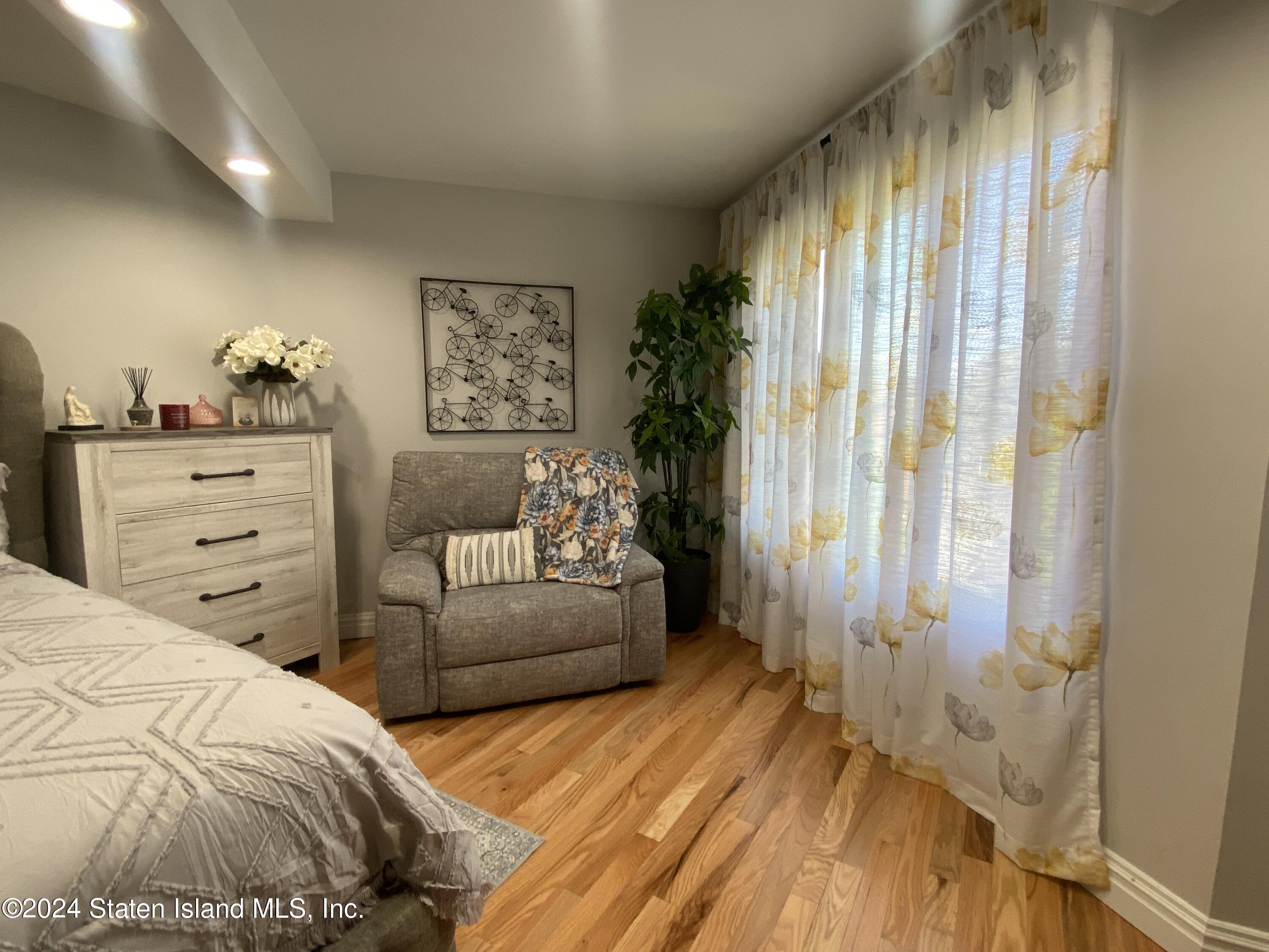 1440 Forest Hill Road, Unit 2 Staten Island, NY 10314 - Photo 17 of 32 a bedroom with a bed and a window