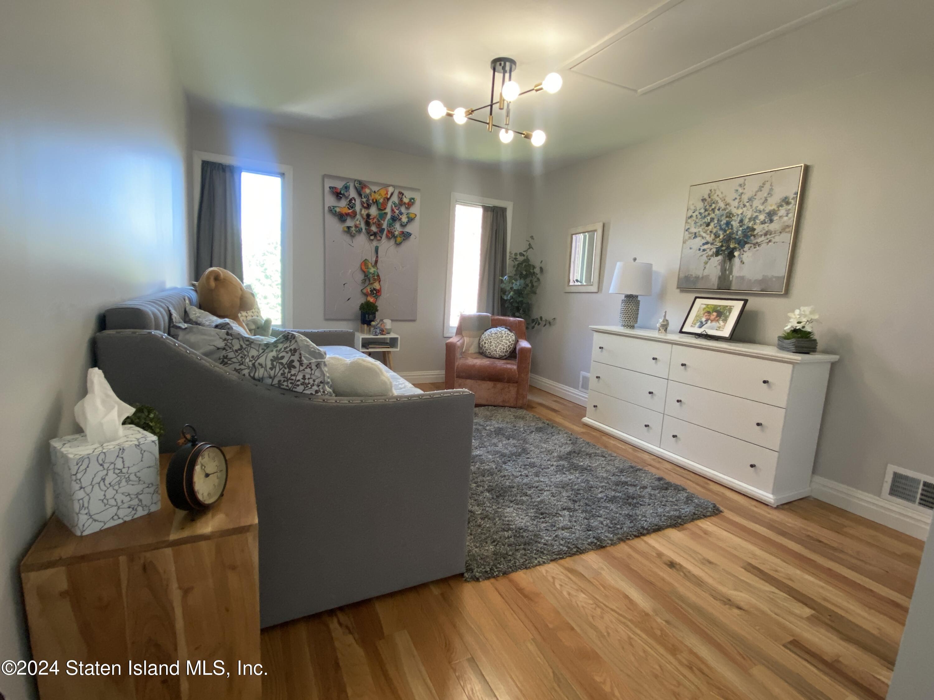 1440 Forest Hill Road, Unit 2 Staten Island, NY 10314 - Photo 18 of 32 a living room with furniture