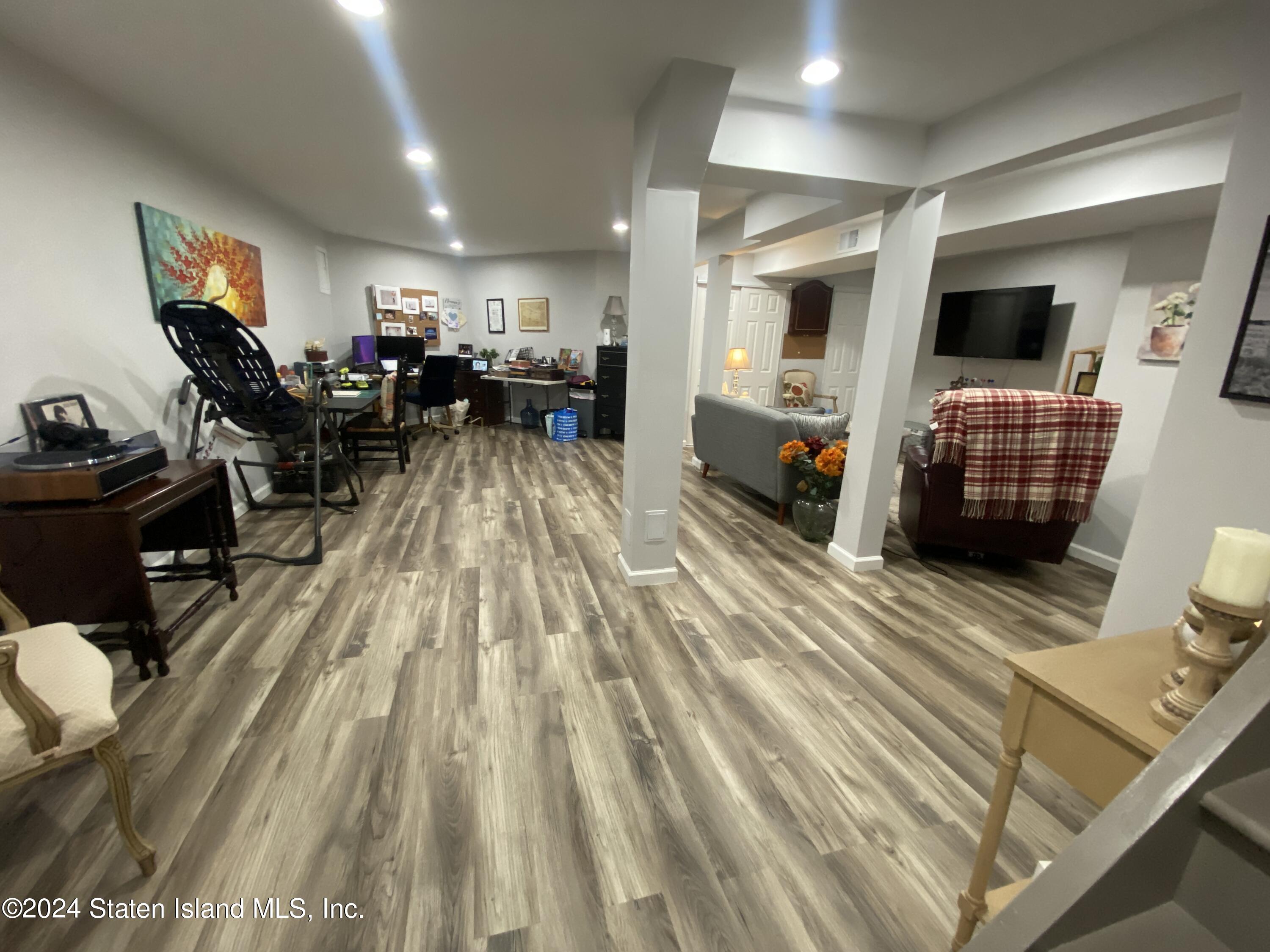 1440 Forest Hill Road, Unit 2 Staten Island, NY 10314 - Photo 21 of 32 a view of a living room and a flat screen tv
