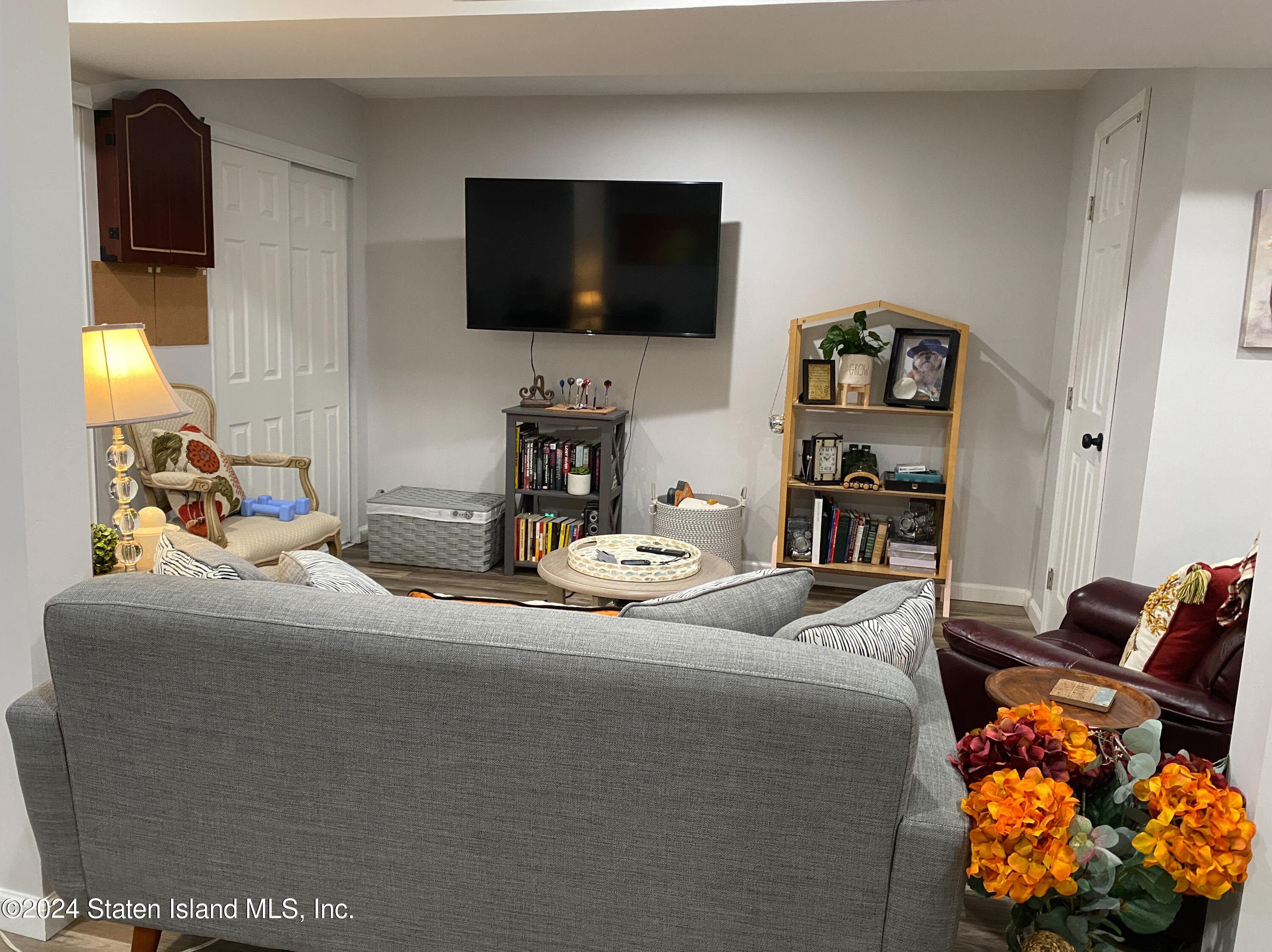 1440 Forest Hill Road, Unit 2 Staten Island, NY 10314 - Photo 24 of 32 a bedroom with a bed and a television