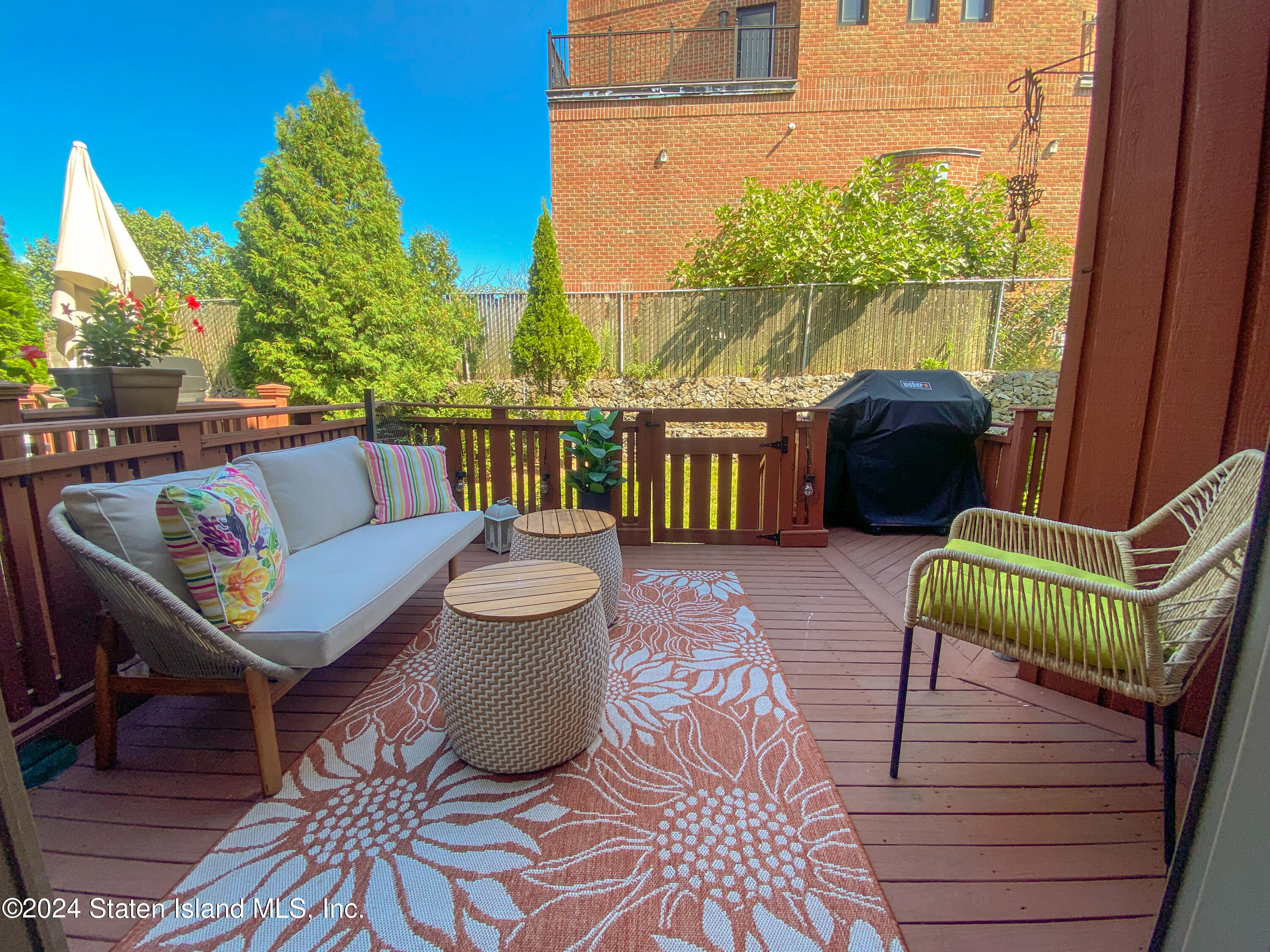 1440 Forest Hill Road, Unit 2 Staten Island, NY 10314 - Photo 26 of 32 a view of a balcony with two chairs and a potted plant