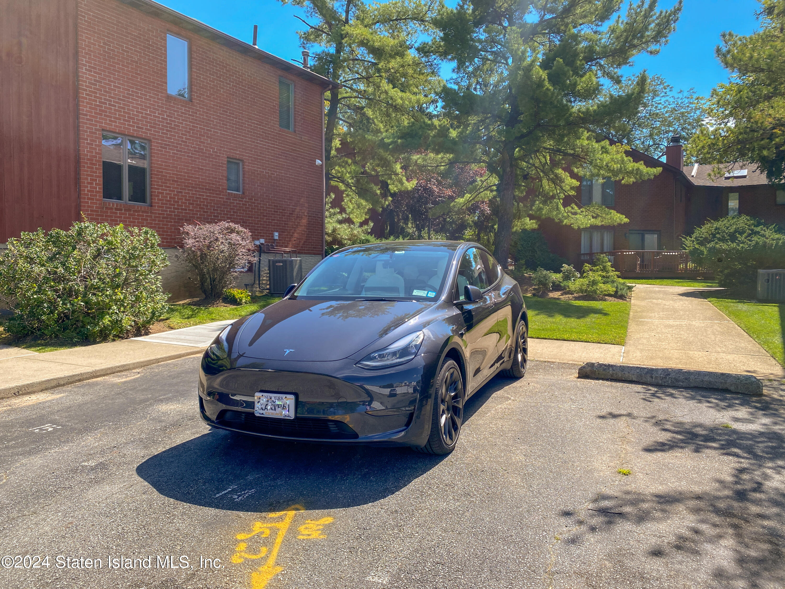 1440 Forest Hill Road, Unit 2 Staten Island, NY 10314 - Photo 29 of 32 a front view of a house with yard