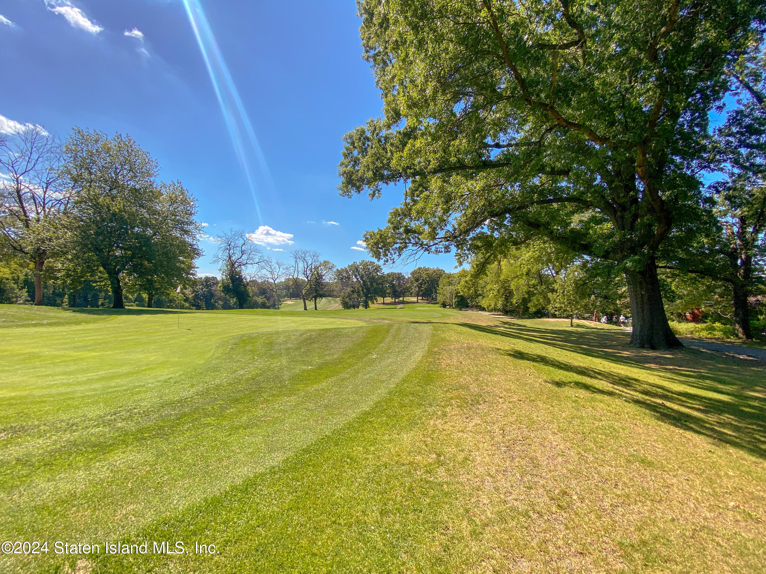 1440 Forest Hill Road, Unit 2 Staten Island, NY 10314 - Photo 31 of 32 a view of an outdoor space and swimming pool