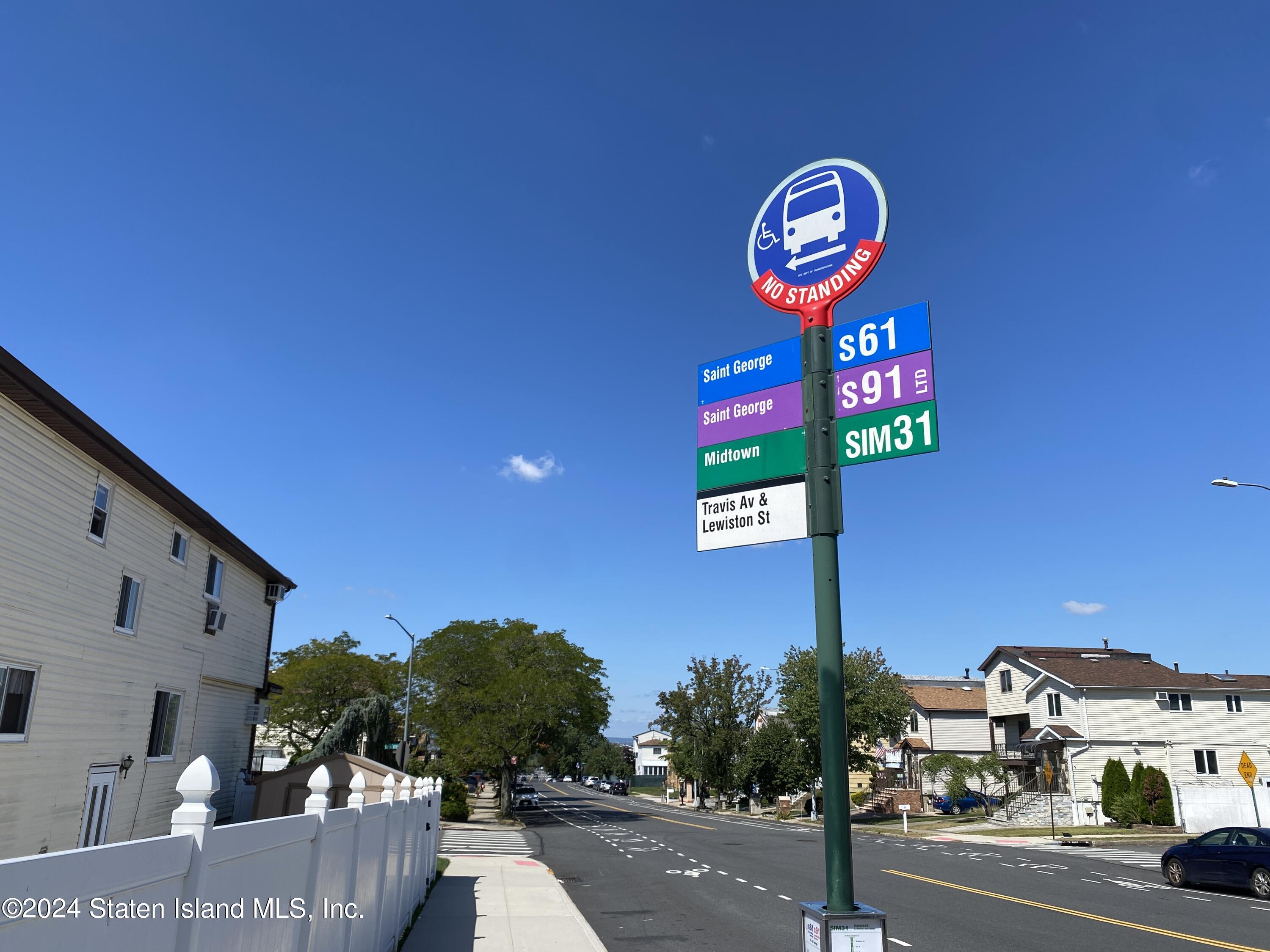 1440 Forest Hill Road, Unit 2 Staten Island, NY 10314 - Photo 32 of 32 a street sign on a wall next to a road