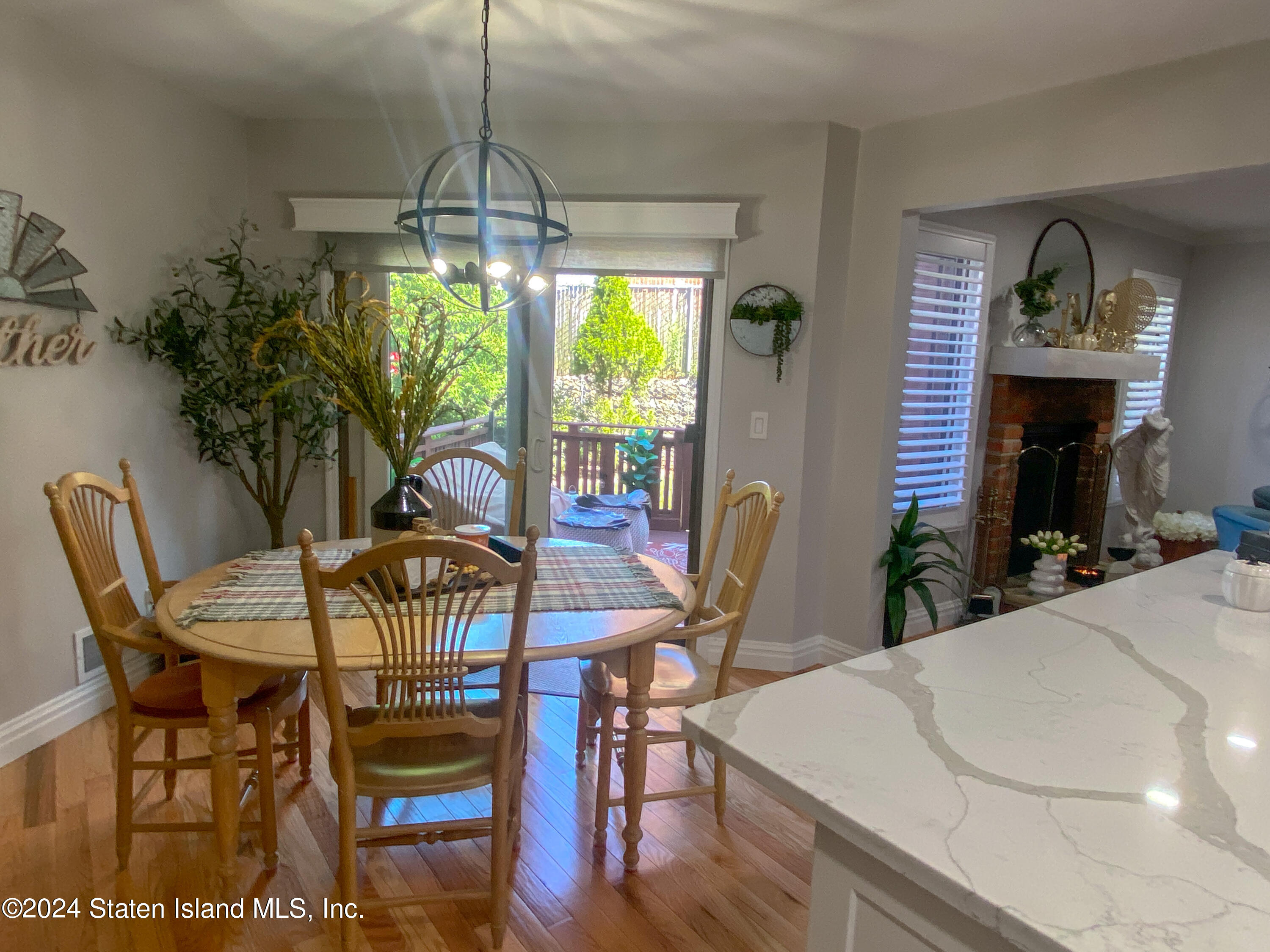 1440 Forest Hill Road, Unit 2 Staten Island, NY 10314 - Photo 8 of 32 a view of a dining room with furniture window and outside view