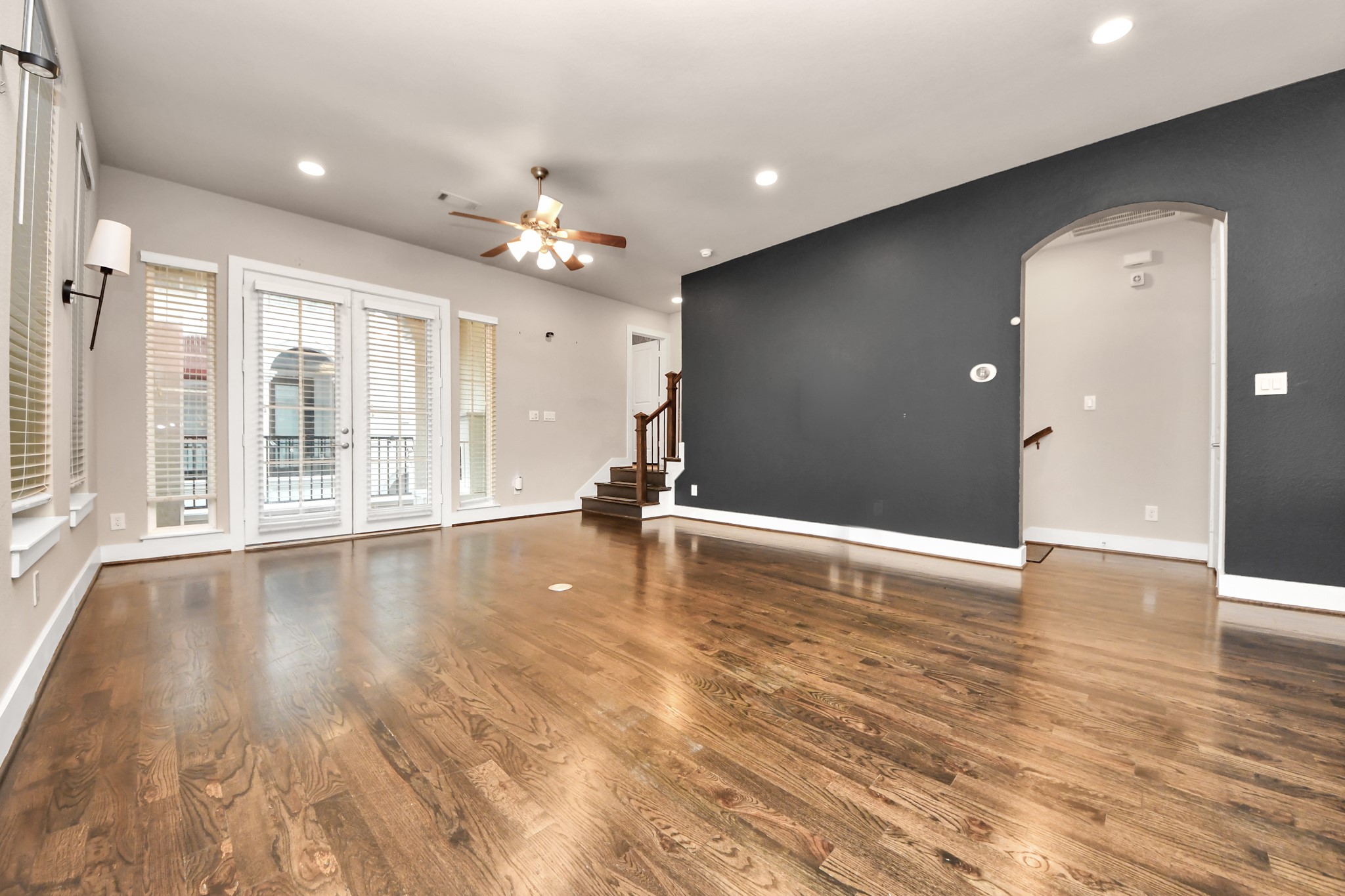 2704 Freund Street Houston, TX 77003 - Photo 10 of 45 an empty room with wooden floor and windows
